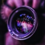 Vibrant reflections in a camera lens; an artistic photography close-up.